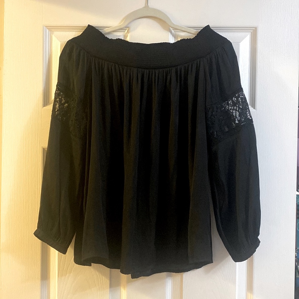 Black off the shoulder blouse with lace detailing in the sleeves